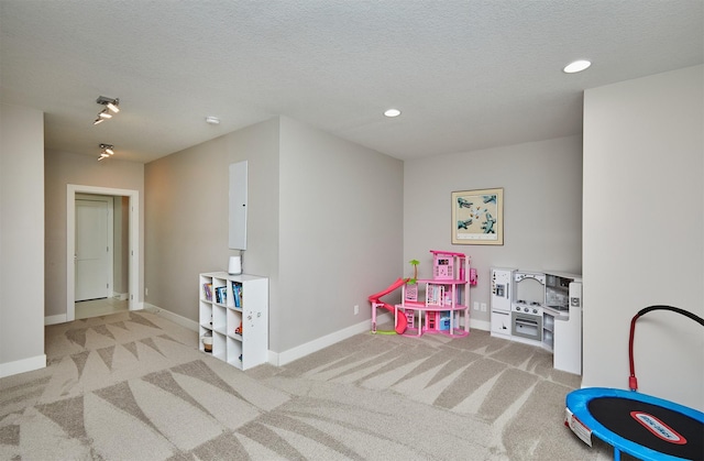 605 S Tiburon Cv, West Des Moines, IA 50266 - playroom featuring carpet floors, recessed lighting, and a textured ceiling