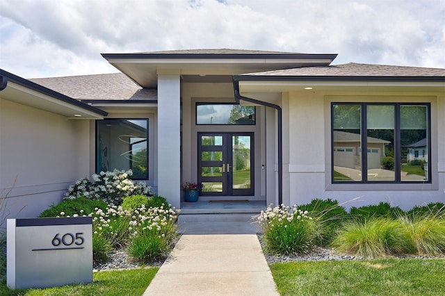 605 S Tiburon Cv, West Des Moines, IA 50266 - doorway to property featuring stucco siding and a shingled roof