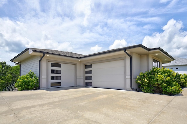 605 S Tiburon Cv, West Des Moines, IA 50266 - view of side of home with concrete driveway and an attached garage