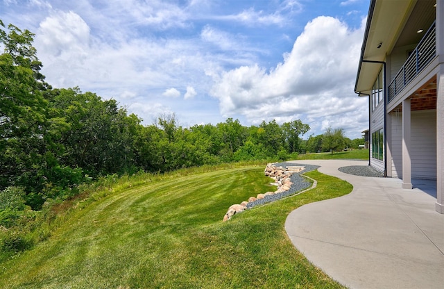 605 S Tiburon Cv, West Des Moines, IA 50266 - view of green lawn with a patio area