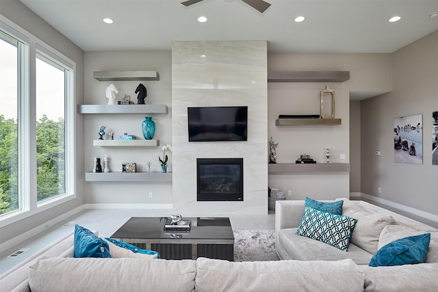 605 S Tiburon Cv, West Des Moines, IA 50266 - living room featuring recessed lighting, a high end fireplace, and ceiling fan