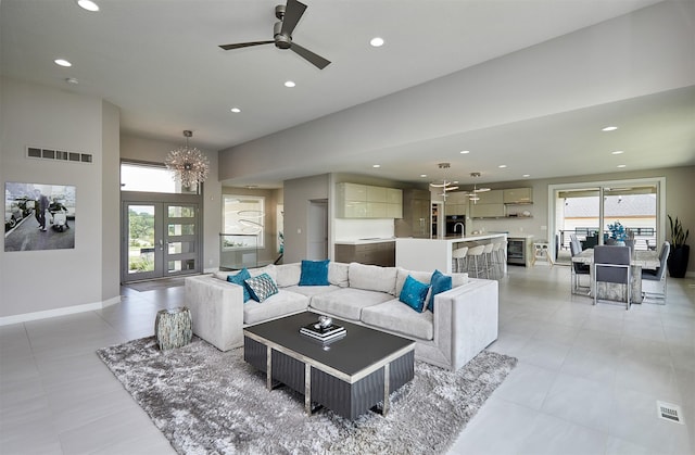 605 S Tiburon Cv, West Des Moines, IA 50266 - living area featuring recessed lighting, ceiling fan, a chandelier, and light tile patterned flooring