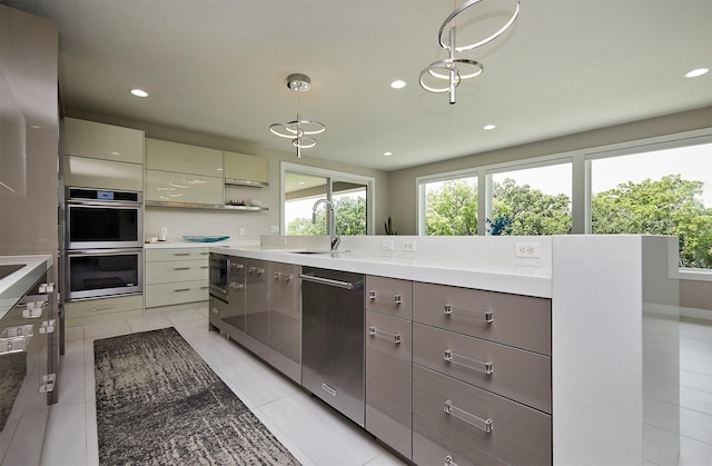 605 S Tiburon Cv, West Des Moines, IA 50266 - kitchen with appliances with stainless steel finishes, modern cabinets, gray cabinetry, recessed lighting, and pendant lighting