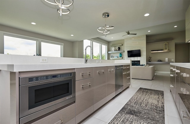 605 S Tiburon Cv, West Des Moines, IA 50266 - kitchen with stainless steel appliances, modern cabinets, light tile patterned flooring, recessed lighting, and gray cabinets