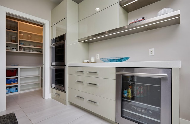 605 S Tiburon Cv, West Des Moines, IA 50266 - walk in closet featuring wine cooler and light tile patterned flooring