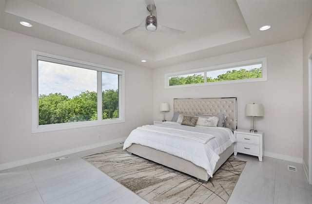 605 S Tiburon Cv, West Des Moines, IA 50266 - bedroom featuring a tray ceiling, recessed lighting, and ceiling fan