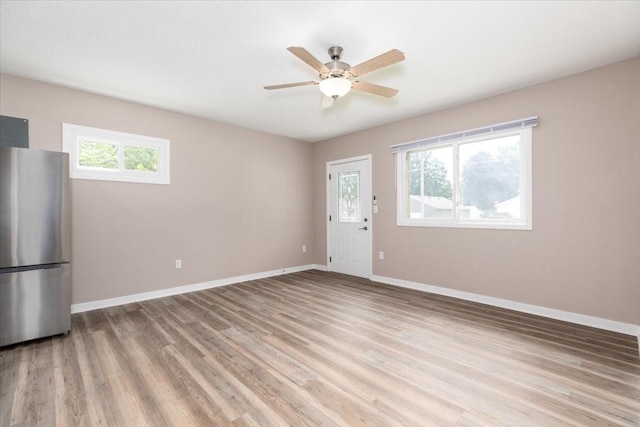 2311 Williams St, Des Moines, IA 50317 - empty room featuring light wood finished floors and ceiling fan