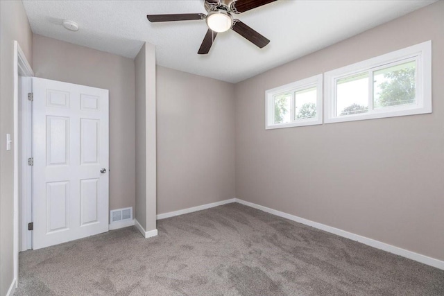 2311 Williams St, Des Moines, IA 50317 - unfurnished bedroom with carpet and ceiling fan