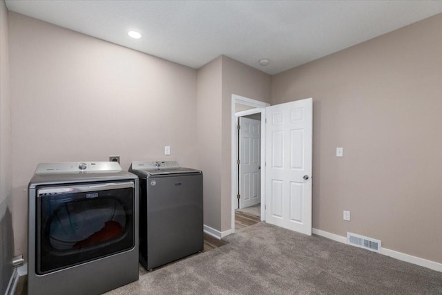 2311 Williams St, Des Moines, IA 50317 - laundry room featuring washing machine and clothes dryer, carpet flooring, and recessed lighting