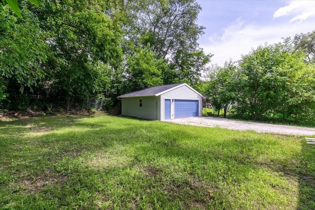2311 Williams St, Des Moines, IA 50317 - view of green lawn with an outdoor structure and a garage