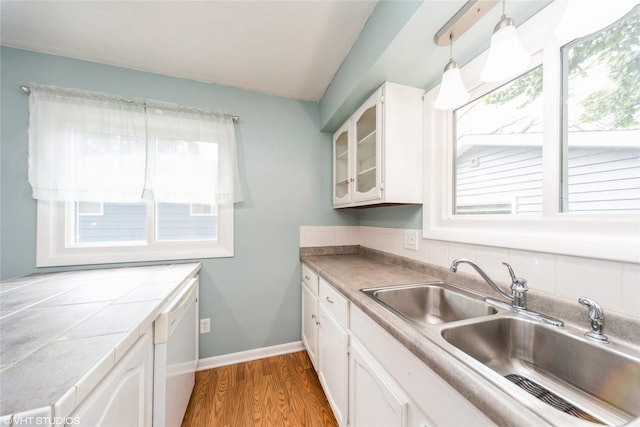 214 SW Scott St, Ankeny, IA 50023 - kitchen with dishwasher, plenty of natural light, and white cabinetry