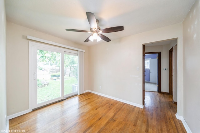214 SW Scott St, Ankeny, IA 50023 - empty room featuring light wood-style flooring and a ceiling fan