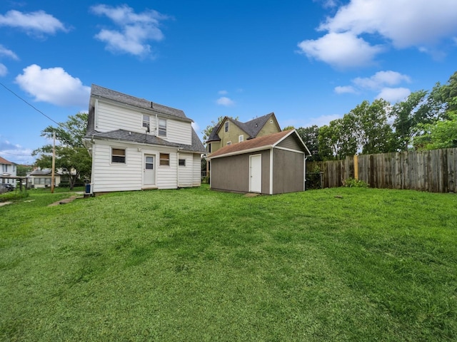 1534 9th St, Des Moines, IA 50314 - back of house with a storage unit