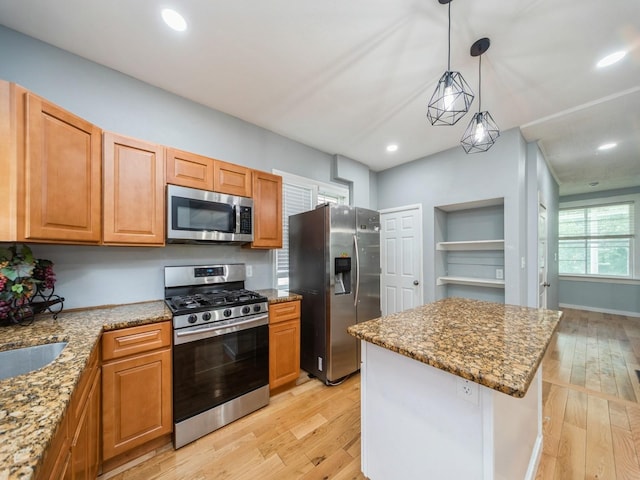 1534 9th St, Des Moines, IA 50314 - kitchen with stainless steel appliances, light wood finished floors, stone countertops, and recessed lighting