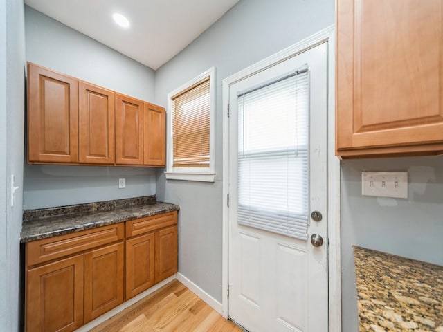 1534 9th St, Des Moines, IA 50314 - doorway to outside with light wood finished floors and baseboards
