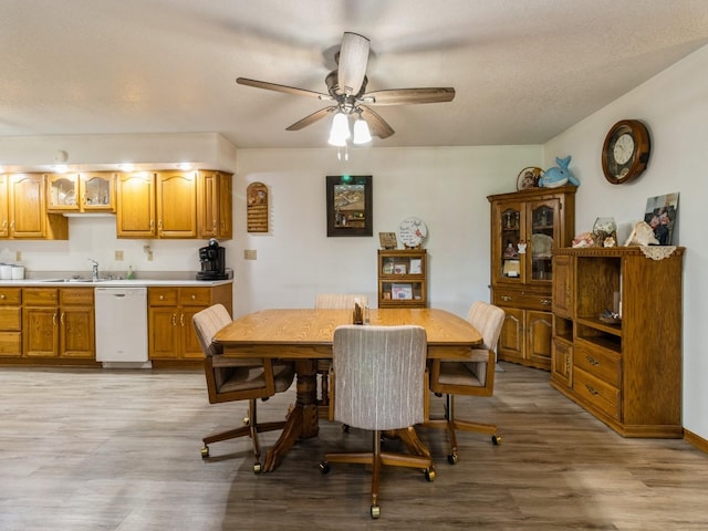 1439 N Shore Dr, Knoxville, IA 50138 - dining room featuring light wood-style flooring and a ceiling fan