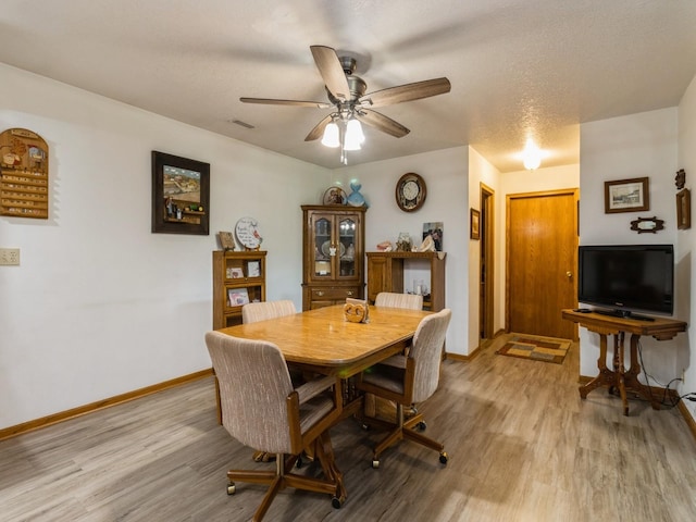 1439 N Shore Dr, Knoxville, IA 50138 - dining space with light wood-type flooring and ceiling fan