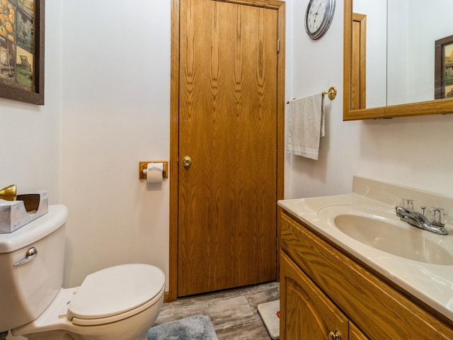 1439 N Shore Dr, Knoxville, IA 50138 - half bath featuring vanity and wood finished floors