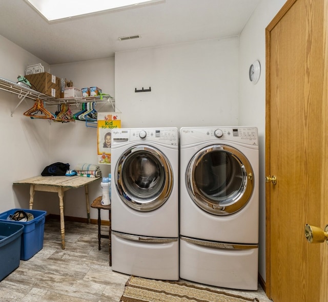 1439 N Shore Dr, Knoxville, IA 50138 - laundry room featuring light wood-type flooring and washer and clothes dryer