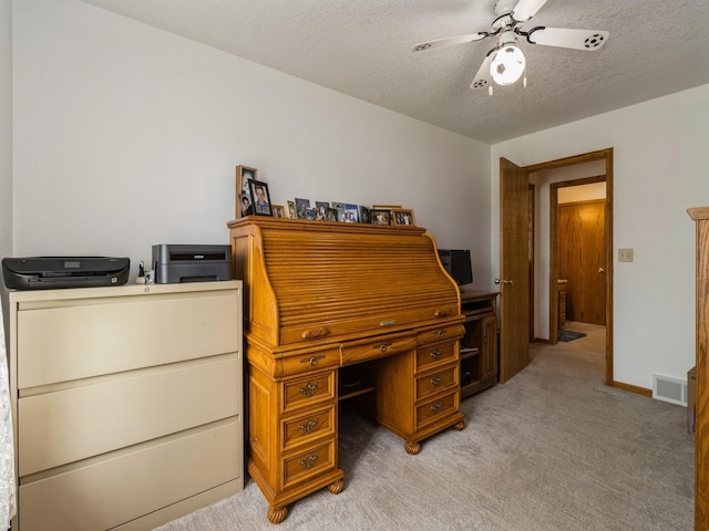 1439 N Shore Dr, Knoxville, IA 50138 - office featuring light carpet, ceiling fan, and a textured ceiling