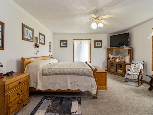 1439 N Shore Dr, Knoxville, IA 50138 - carpeted bedroom featuring a ceiling fan