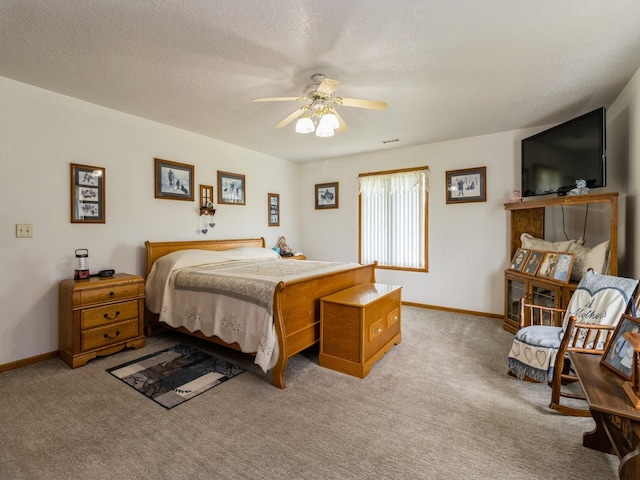 1439 N Shore Dr, Knoxville, IA 50138 - bedroom featuring carpet, ceiling fan, and a textured ceiling