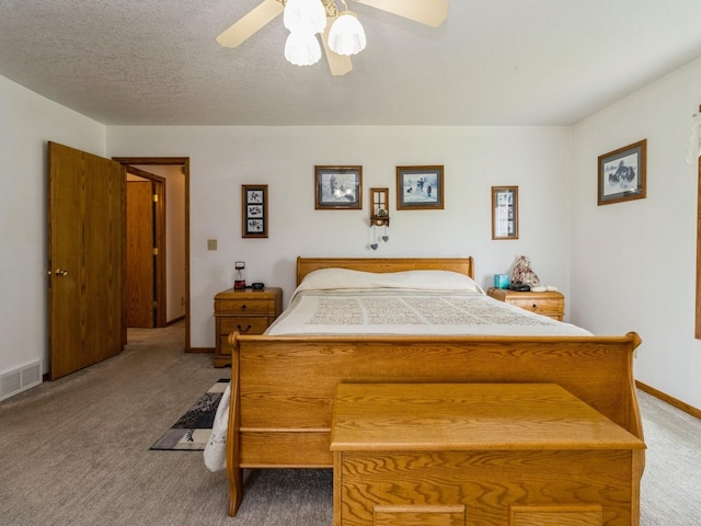 1439 N Shore Dr, Knoxville, IA 50138 - carpeted bedroom featuring baseboards and ceiling fan