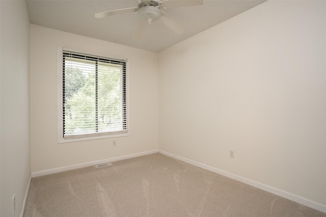 3600 E 42nd Ct, Des Moines, IA 50317 - carpeted empty room with baseboards and a ceiling fan