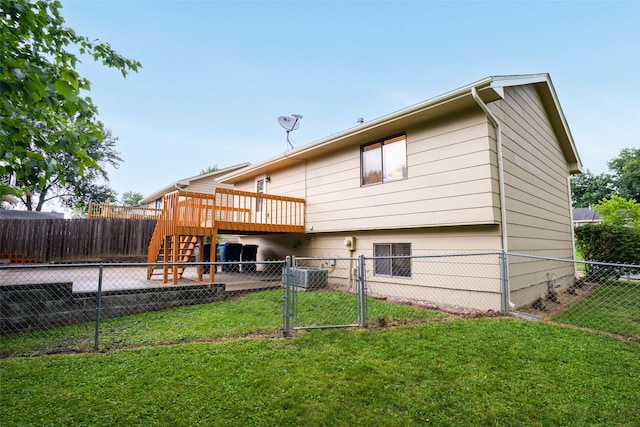 3600 E 42nd Ct, Des Moines, IA 50317 - rear view of house with a fenced backyard, a gate, and a wooden deck