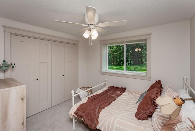 519 16th Avenue Ct SE, Altoona, IA 50009 - bedroom featuring carpet, a closet, and ceiling fan