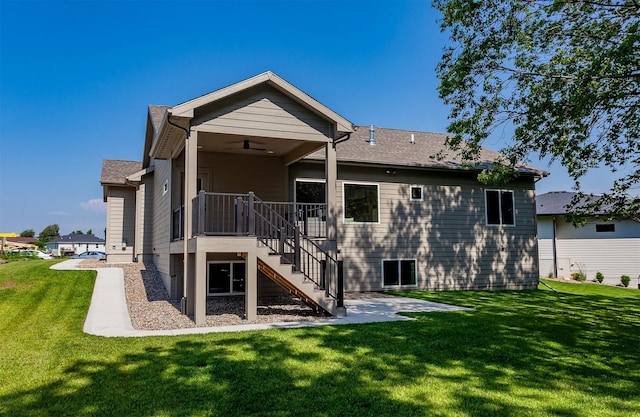 519 16th Avenue Ct SE, Altoona, IA 50009 - back of property featuring stairs, a yard, a ceiling fan, and a patio