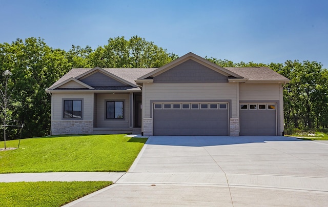 519 16th Avenue Ct SE, Altoona, IA 50009 - craftsman inspired home with stone siding, a garage, concrete driveway, and a front yard
