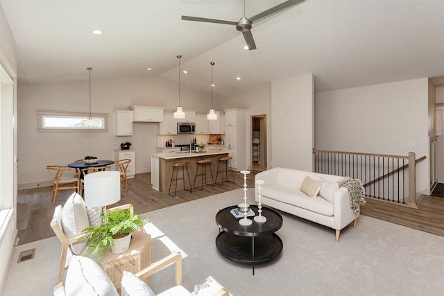 519 16th Avenue Ct SE, Altoona, IA 50009 - living area featuring light wood finished floors, lofted ceiling, ceiling fan, and recessed lighting