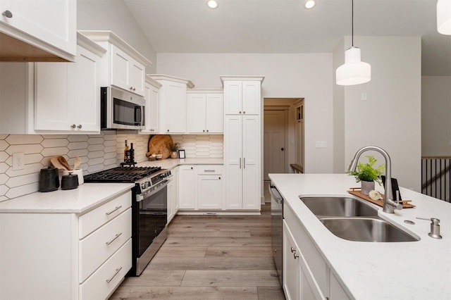 519 16th Avenue Ct SE, Altoona, IA 50009 - kitchen with appliances with stainless steel finishes, light wood-style flooring, light countertops, decorative backsplash, and recessed lighting