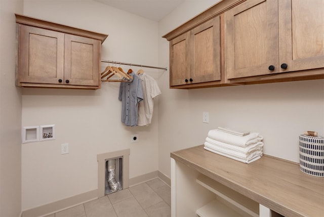 519 16th Avenue Ct SE, Altoona, IA 50009 - laundry room with cabinet space, hookup for an electric dryer, light tile patterned flooring, and hookup for a washing machine