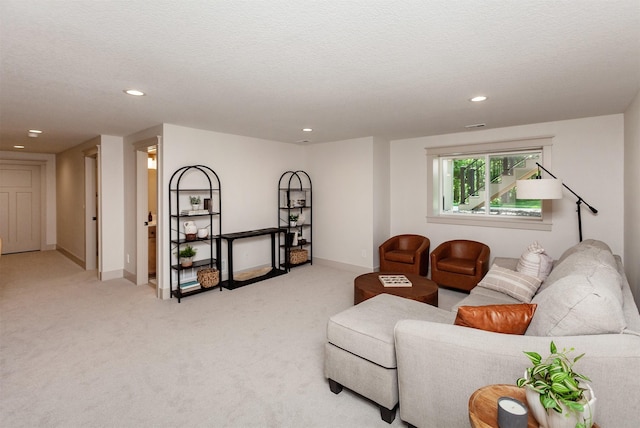 519 16th Avenue Ct SE, Altoona, IA 50009 - living room featuring light colored carpet, recessed lighting, and a textured ceiling