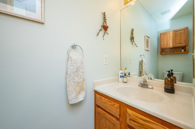 9102 NW Windsor Dr, Johnston, IA 50131 - bathroom featuring vanity and toilet