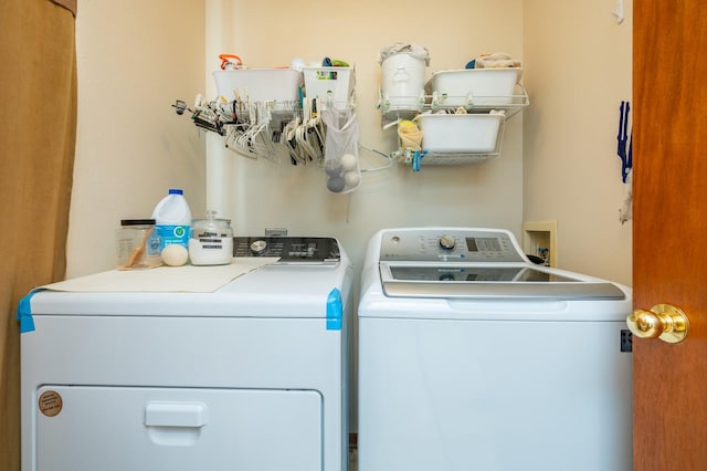 9102 NW Windsor Dr, Johnston, IA 50131 - laundry room with washing machine and clothes dryer