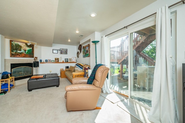9102 NW Windsor Dr, Johnston, IA 50131 - living area with a tiled fireplace, carpet flooring, and recessed lighting