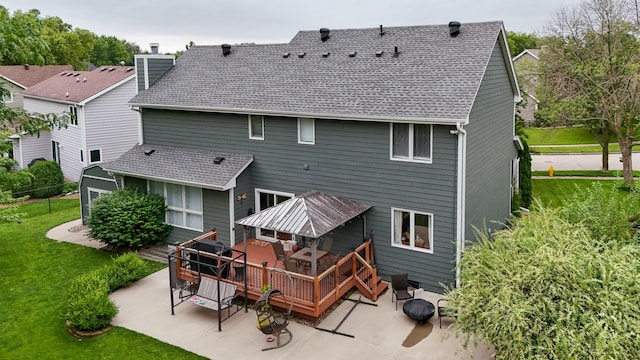 5526 Kensington Cir, Johnston, IA 50131 - back of property featuring a patio, a lawn, a deck, and roof with shingles