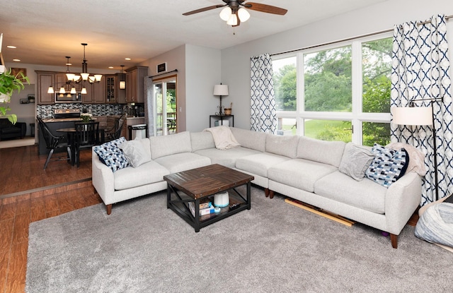 5526 Kensington Cir, Johnston, IA 50131 - living area with dark wood finished floors, a chandelier, ceiling fan, healthy amount of natural light, and recessed lighting