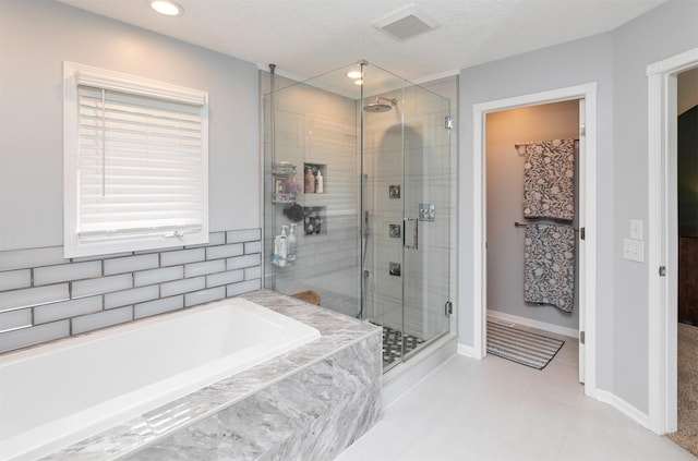 5526 Kensington Cir, Johnston, IA 50131 - full bath with a shower stall, a garden tub, tile patterned flooring, and recessed lighting