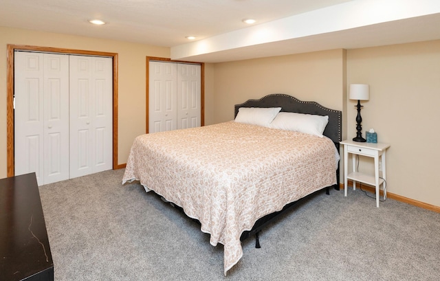 5526 Kensington Cir, Johnston, IA 50131 - bedroom with carpet floors, two closets, and recessed lighting