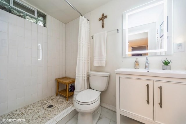 4505 75th St, Urbandale, IA 50322 - bathroom featuring a tile shower and vanity