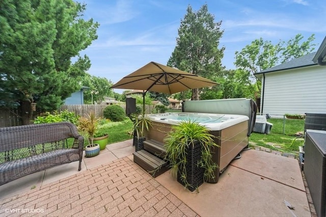 4505 75th St, Urbandale, IA 50322 - fenced backyard featuring a hot tub and a patio area