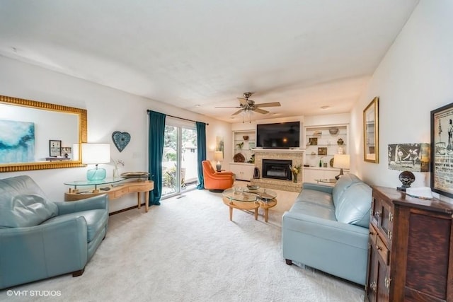 4505 75th St, Urbandale, IA 50322 - living room with a brick fireplace, a ceiling fan, and carpet flooring