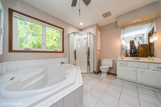 4505 75th St, Urbandale, IA 50322 - bathroom with vanity, a shower stall, a garden tub, tile patterned floors, and a ceiling fan
