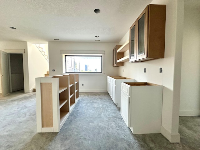 880 Harrington Way, Waukee, IA 50263 - kitchen with open shelves, light colored carpet, and a textured ceiling