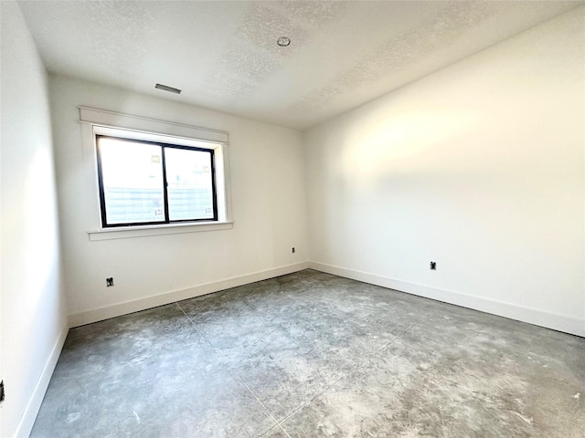 880 Harrington Way, Waukee, IA 50263 - unfurnished room with concrete flooring and a textured ceiling