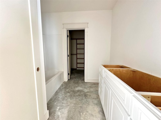 880 Harrington Way, Waukee, IA 50263 - full bathroom featuring unfinished concrete floors, a bath, and vanity